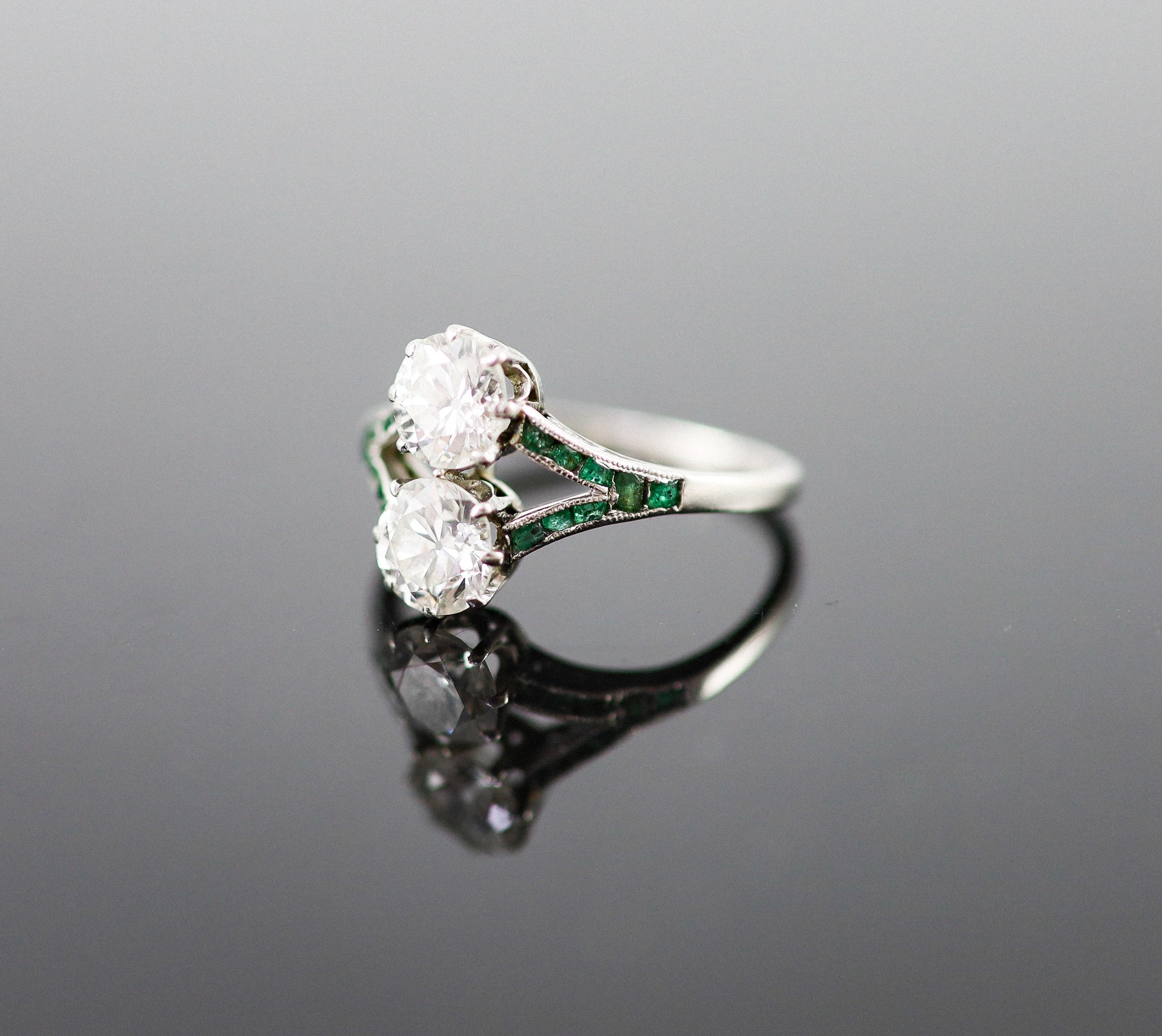 A 1920's platinum and two stone diamond ring